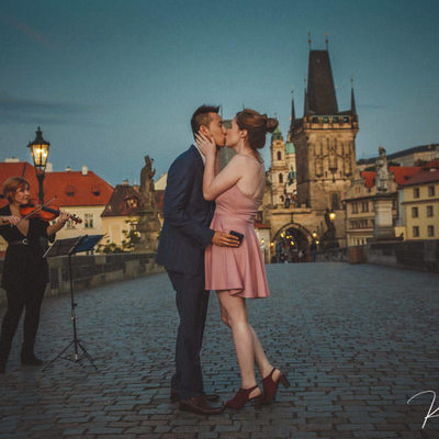 A kiss for the newly engaged Charles Bridge twilight