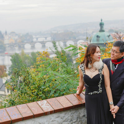 A portrait of the mom & dad overlooking Prague