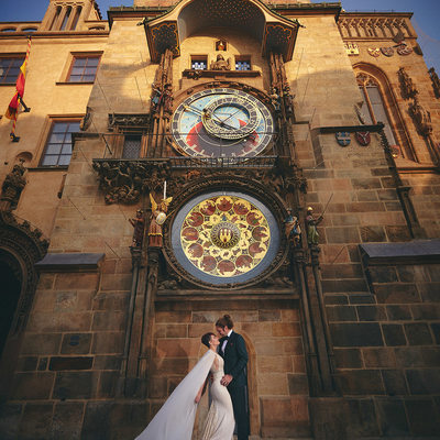 Bride in Berta dress underneath Astronomical Clock