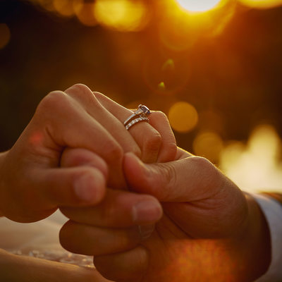 Bride & Grooms rings sunrise photo