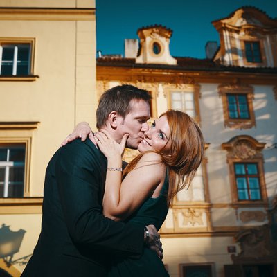 sexy-fun kiss captured at sunset Prague Castle