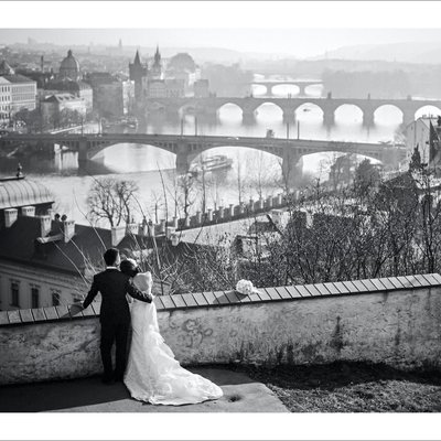elegant b&w portrait  bride & groom overlooking Prague