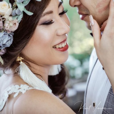bride & groom enjoying the moment as lipstick marks his face