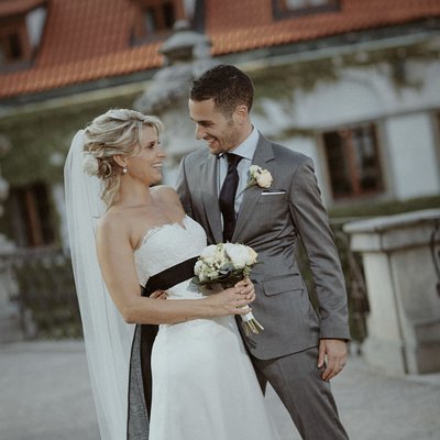 bride & groom having a laugh at the Vrtba Garden
