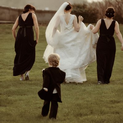 Page boy chases after the bride Carton House Ireland