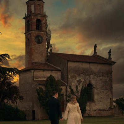 newlyweds stroll the grounds of Villa Godi, Italy
