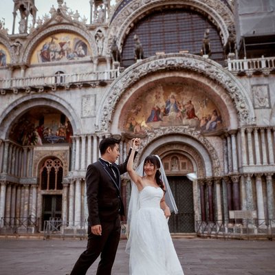 Twirling his bride in front of St Mark's Basilica Venice