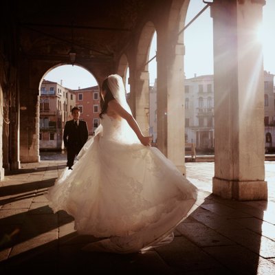bride spinning in her wedding gown Venice, Italy 
