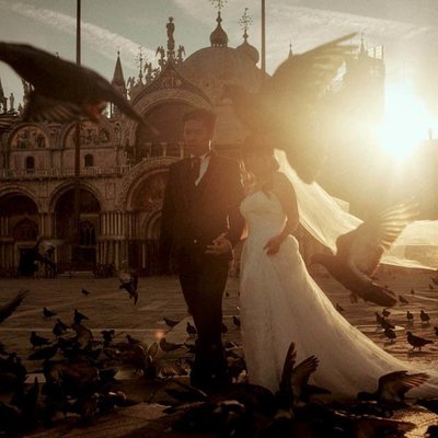 Sun flared bride & groom in San Marco Venice