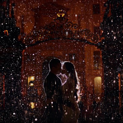 magical kiss in the rain at night at Prague Castle