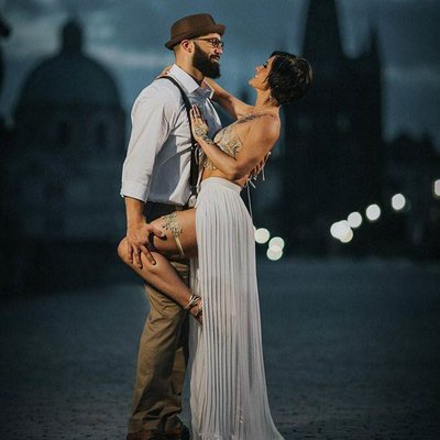 twilight hour sexy couple atop Charles Bridge
