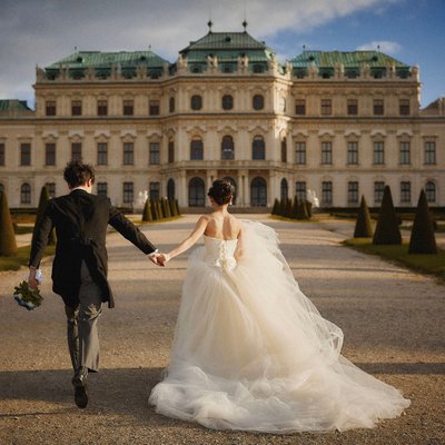 Bride & Groom running Belvedere Palace grounds Vienna
