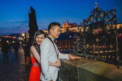 Hong Kong Newlyweds making a wish on the Charles Bridge 