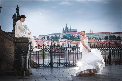 Bride twirling wedding dress near Charles Bridge