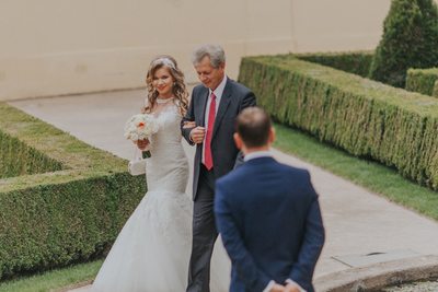 Father of the bride escorts her to the groom