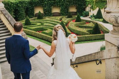 escorting his bride down the stairs 