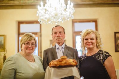 The parents wait with the traditional bread