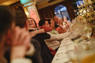 groom hugs guests