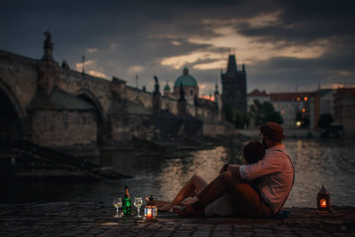 Watching sunrise over the Charles Bridge with Champagne