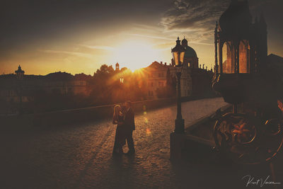 sunrise love atop the Charles Bridge