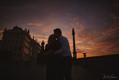 Christie & Michael snuggle at Prague Castle at sunrise