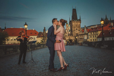 A kiss for the newly engaged Charles Bridge twilight