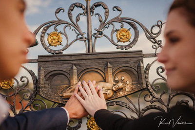 Making a wish on the Charles Bridge Engagement photo