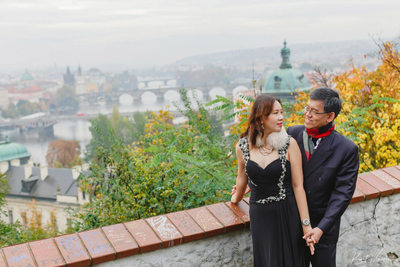 A portrait of the mom & dad overlooking Prague