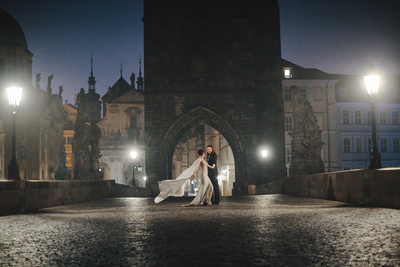 Dancing atop the Charles Bridge at night