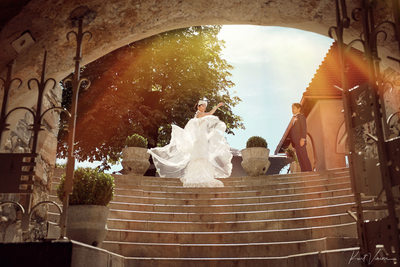 Bride fluffing her wedding dress Bled Castle Slovenia