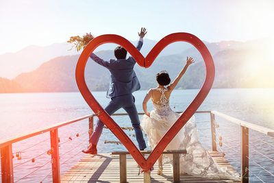 Jumping for joy with the 'Heart of Bled' wedding couple