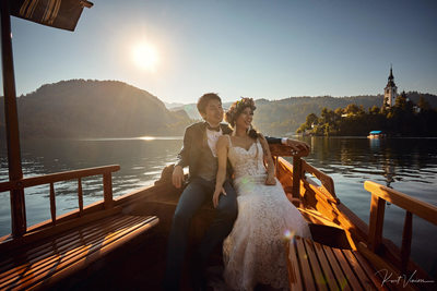 Lake Bled bride & groom couple enjoying boat ride