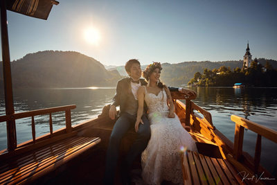 newlyweds enjoying boat ride 