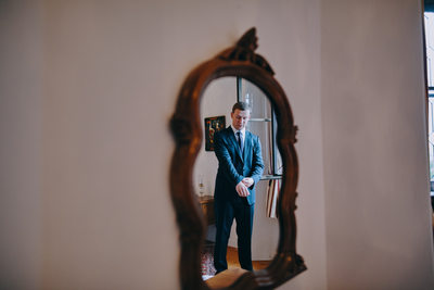 groom in mirror