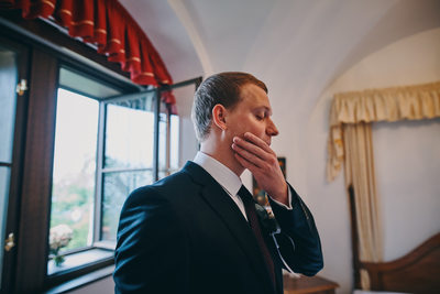 Nervous groom in hotel Stejkl