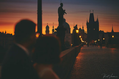 watching the sunrise Charles Bridge Prague Engagement