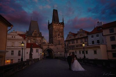 twilight lovers atop Charles Bridge