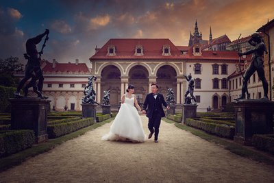 Elegant Macau couple strolling in Wallenstein Garden