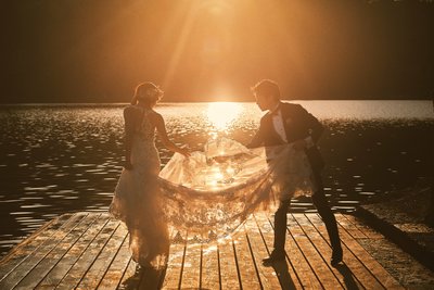 Lake Bled weddigns fixing the brides dress Golden Light