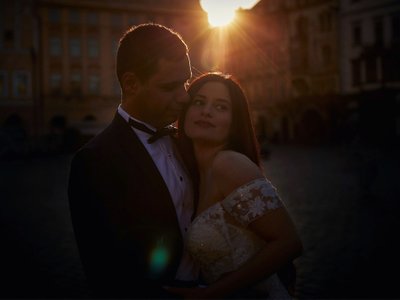 A portrait of the bride & groom Old Town Square sunrise