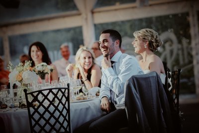 Groom listening to Best Man's speech