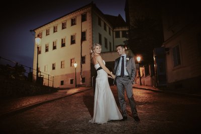 sexy newlyweds at Prague Castle at night