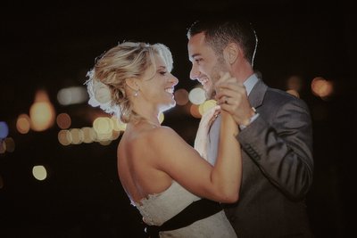 Happy newlyweds during 1st dance overlooking Prague