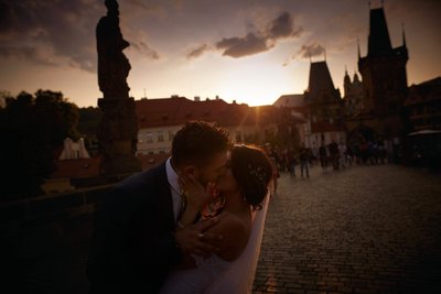 Israeli bride & groom kissing in fading light