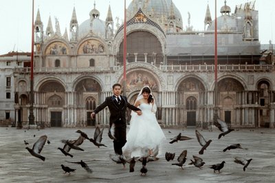 running through pigeons St Mark's Basilica Venice