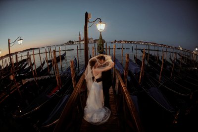 covering the groom with her veil