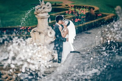 Stylish Couple kissing near the fountains in Cesky Krumlov