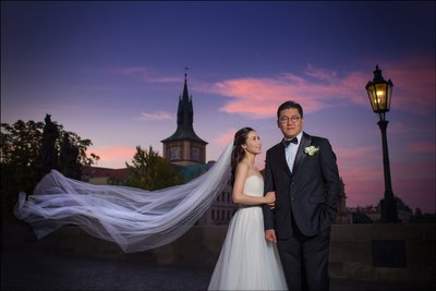 stylish South Korean Newlyweds atop Charles Bridge