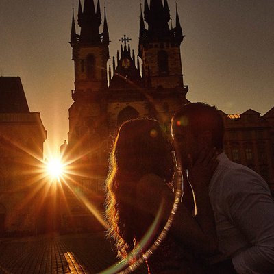 Sun flared sunrise engagement in the Old Town Square
