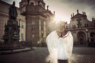 Korean bride posing like an Angel near Charles Bridge